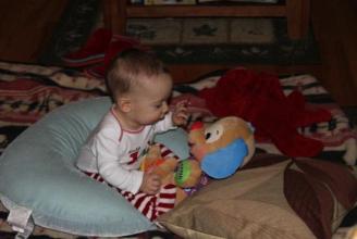 Aedan on Christmas Morning ~ Playing with the puppy we gave him. It's one of his fave gifts.
