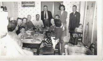 Christmas at Grandma's House 1948 ~ That's me in the highchair next to the electrical plugs!!