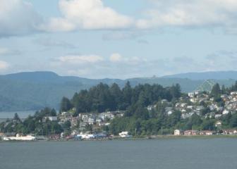 Flying the approach to Astoria ~  Almost at the mouth of the Columbia River, the bridge in the right corner of the picture joins Oregon and Washington. I took this just as we were coming down to land. 