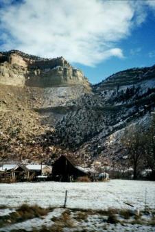 Homestead beneath the cliffs ~  Somewhere along I-70: E Utah - W Colorado. 