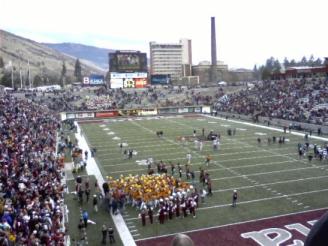 In copper and gold. Montana Griz celebrate. ~  After every game the UM team comes to the northeast corner of the stadium and chants. Surrounded by a sea of maroon, they wear their copper and gold retro uniforms (last seen in 1995) as they proudly celebrate a 35-3 win over their arch-rivals, the Montana State Bobcats in the 108th meeting of the two schools. 