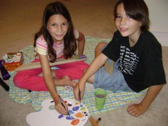 Sidney and Cody 9/15/09 ~  The kids wanted in on our family painting project, so they got some of the scrap wood left over from the frame Christian made and painted them.  We'll put them on the wall too, bien sur! 