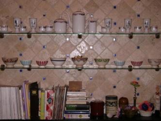 Closer look ~  We loved the tile we put in our backsplash that we used it in the shelf, which is on the wall opposite the backsplash.  The blue tiles are glass, the rest is travertine (tumbled marble). 