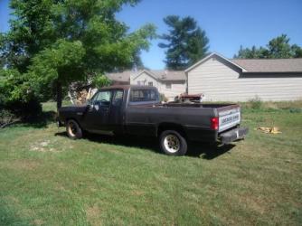 Untitled ~  This is the Dodge that also has the interior hood release ripped off.   Note the size of the house in relationship to the size of the Shop.  Another Wisconsin thing.  The Dodge has a Cunnings engine and I rescued it from a salvage yard in route to China.. 