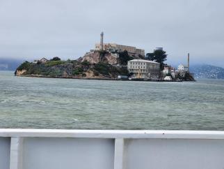 Alcatraz ~  Alcatraz Island (/ˈælkəˌtræz/) is a small island 1.25 miles (2.01 km) offshore from San Francisco, California, United States.  The island was developed in the mid-19th century with facilities for a lighthouse, a military fortification, and a military prison. In 1934, the island was converted into a federal prison, Alcatraz Federal Penitentiary. The strong currents around the island and cold water temperatures made escape nearly impossible, and the prison became one of the most notorious in American history.  In 1963 Bobby Kennedy ordered the prison closed, and the island is now a major tourist attraction.  Some of its most notorious prisoners were ...